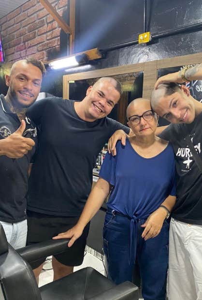 barbers shave heads for mom going through chemo