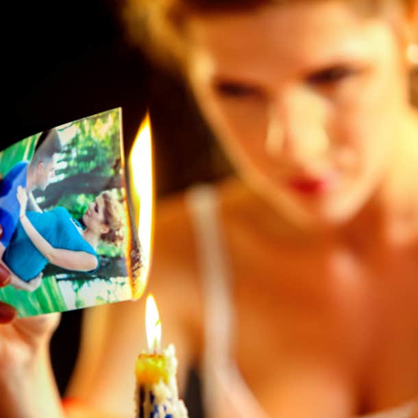woman burning a photo