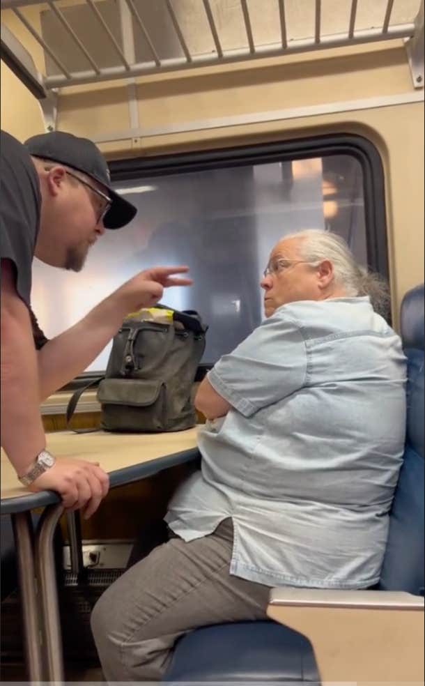 train conductor confronting bigoted train passenger