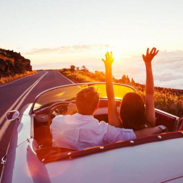 couple driving on winding road