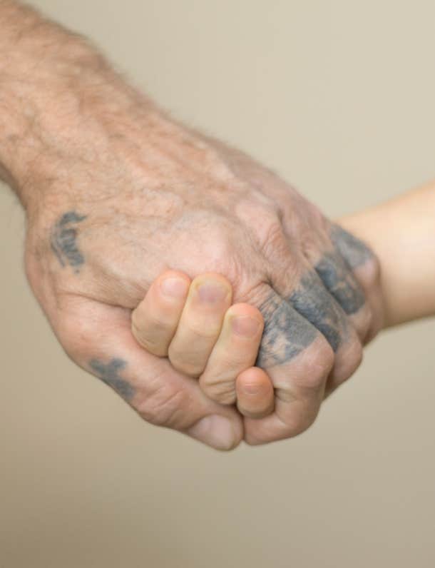 fading tattoo on old man's hand