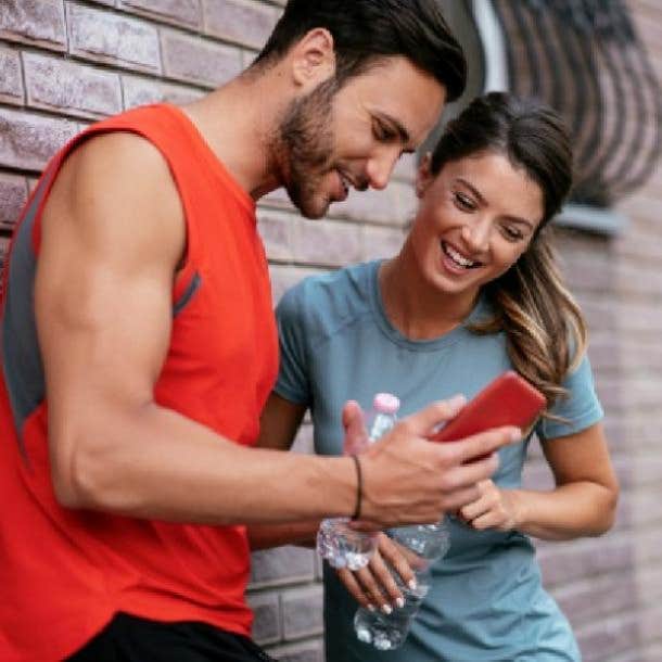 guy showing girl he likes something on his phone