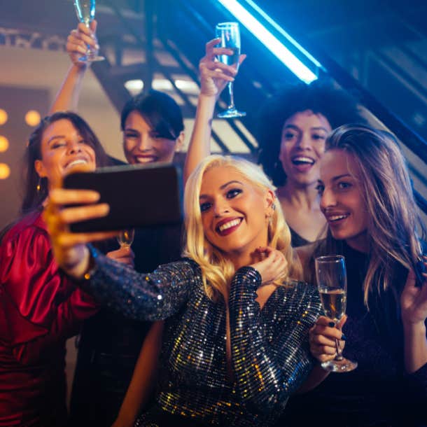 girls out at a bar taking a selfie