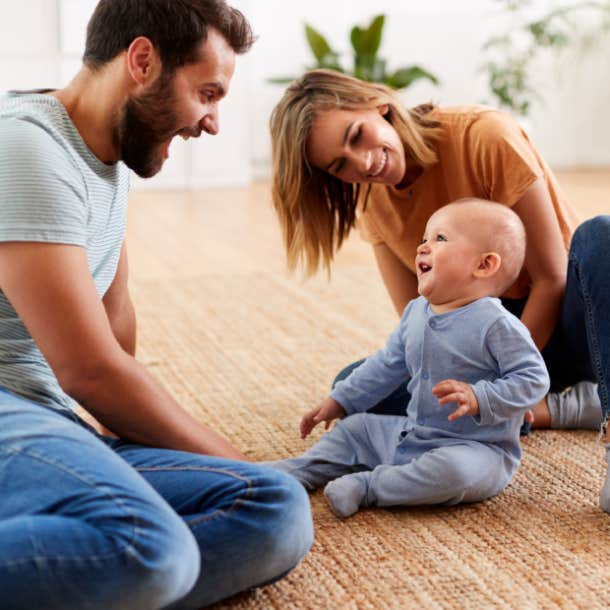 couple playing with baby