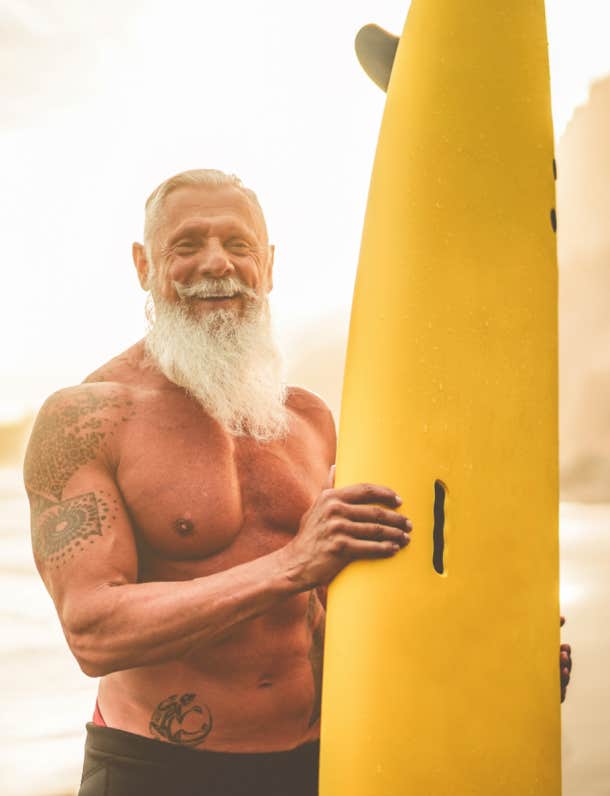 tattooed senior surfer
