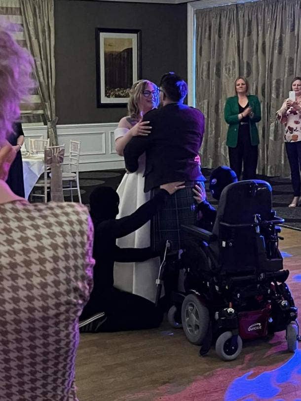 groom with MS stands up for first dance