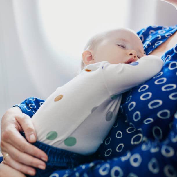 woman asks couple not to change their baby's diaper on tray table while on flight