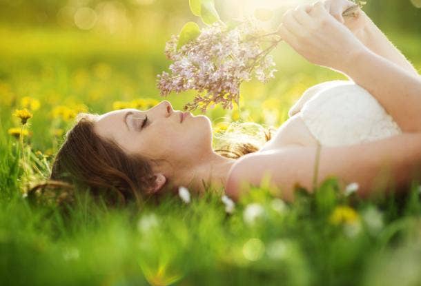 Woman in a field with flowers