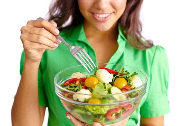 Woman eating salad