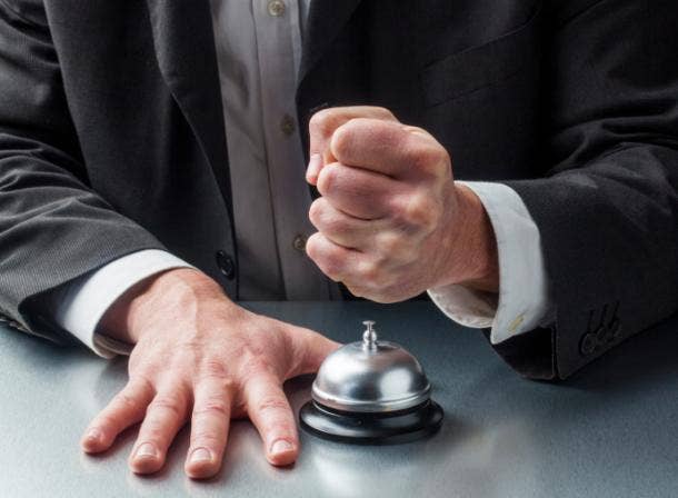 Man ringing a service bell