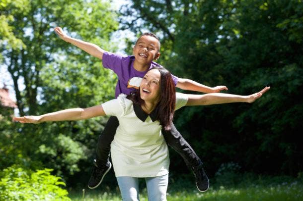 Mom and son pretending to fly