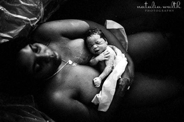 A mother resting with her baby.