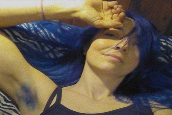 Woman with blue armpit and head hair.