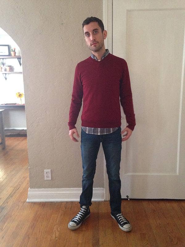 man in red sweater and jeans