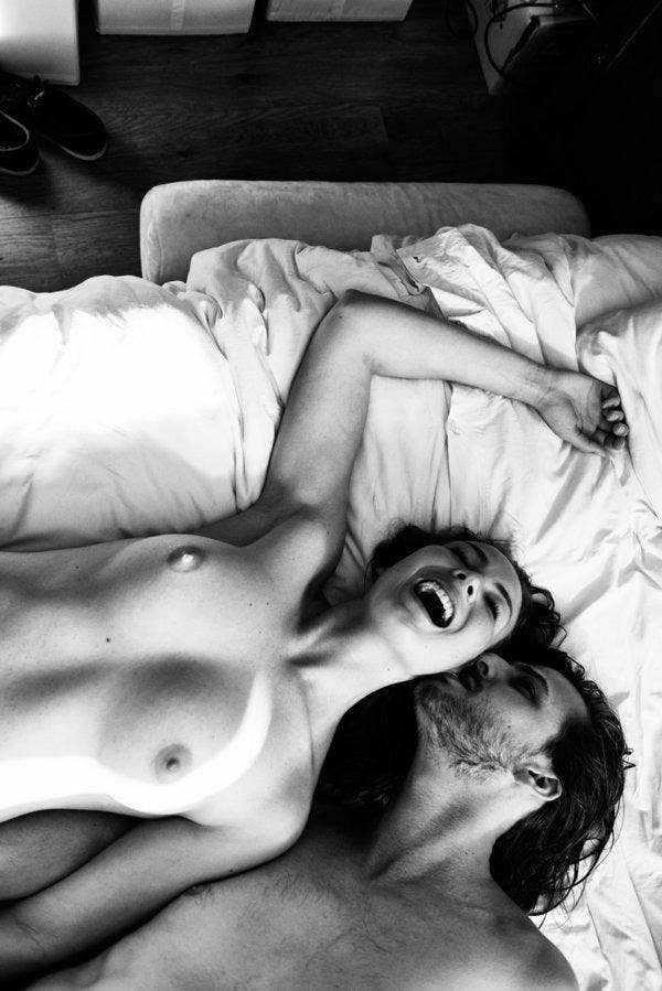 Naked couple laughing. 