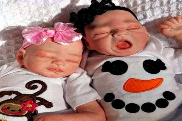 Two babies taking a nap.