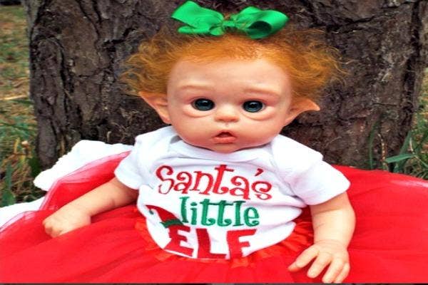 Elf baby in tee shirt.