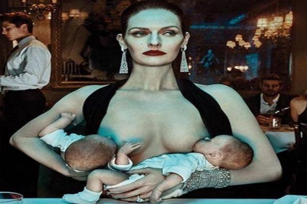 Mother breastfeeding in a restaurant.