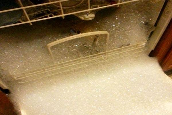 Bubbles oozing out of dishwasher.