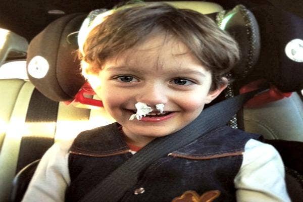 Kid with Kleenex in his nose.