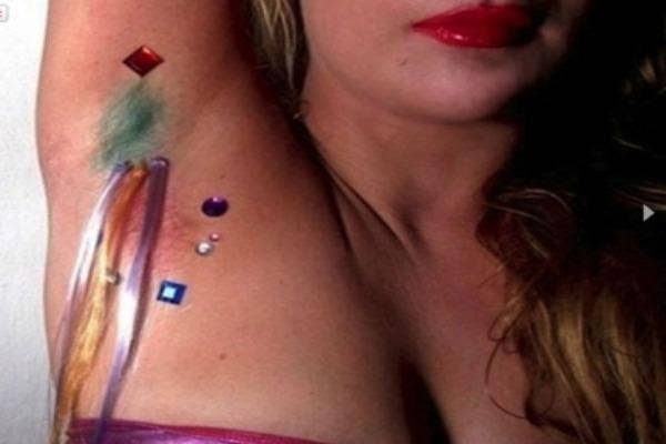 Dyed underarm hair extensions with fake gemstones