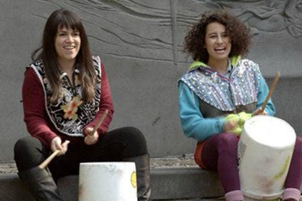 Abbi and Ilana play bucket drums