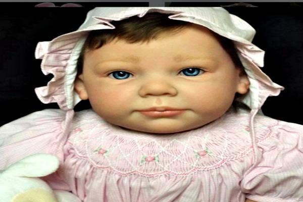 Old fashioned looking doll.