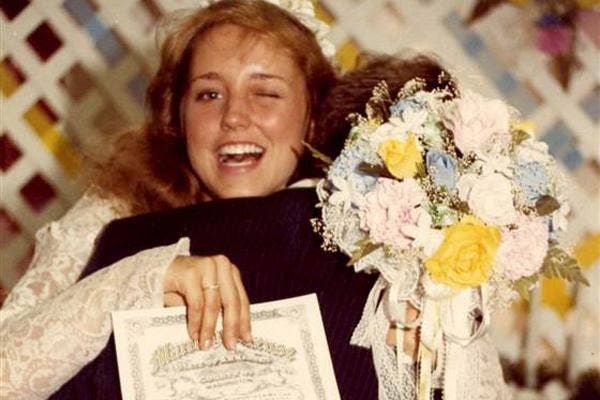 Michelle Duggar wedding photo marriage certificate winking