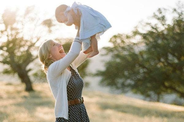 mom holding baby