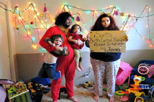 Family with woman holding a sign.