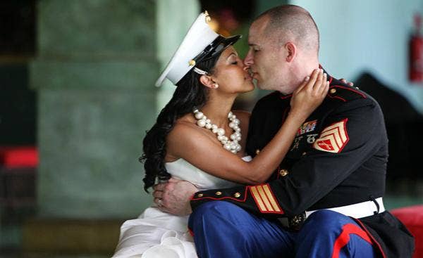 woman kissing her marine husband
