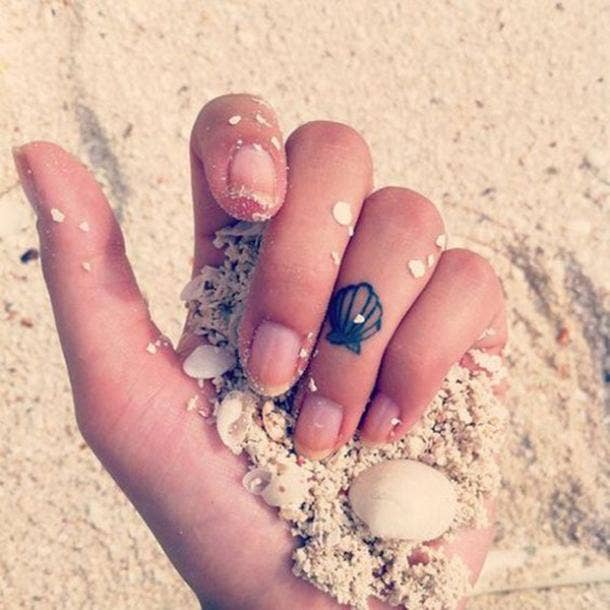 <strong>If you love the beach, then this tiny seashell is shore perfect.</strong> Tattoos For Her