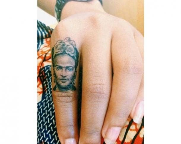 A small finger tattoo LOADED with detail. frida kahlo 19