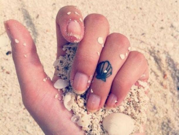 4. Seashell tiny tattoos