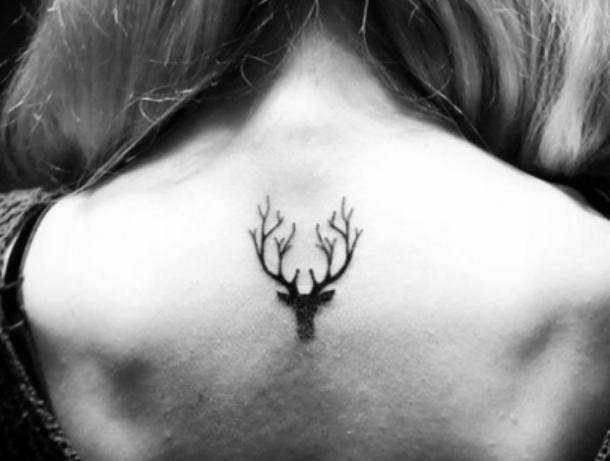 9. Deer with antlers tiny tattoos