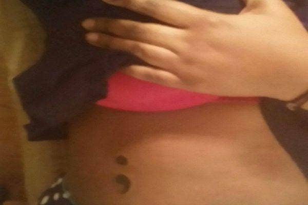 Semicolon tattoo on stomach