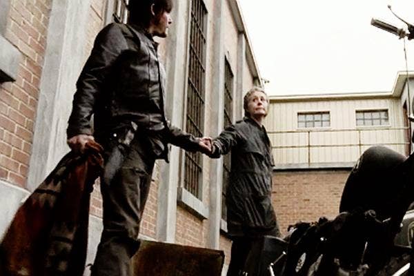 AMC The Walking Dead Melissa McBride as Carol Pelletier and Norman Reedus as Daryl Dixon motorcycle