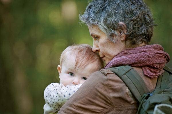 AMC The Walking Dead Melissa McBride as Carol Pelletier and Norman Reedus as Daryl Dixon baby Judith