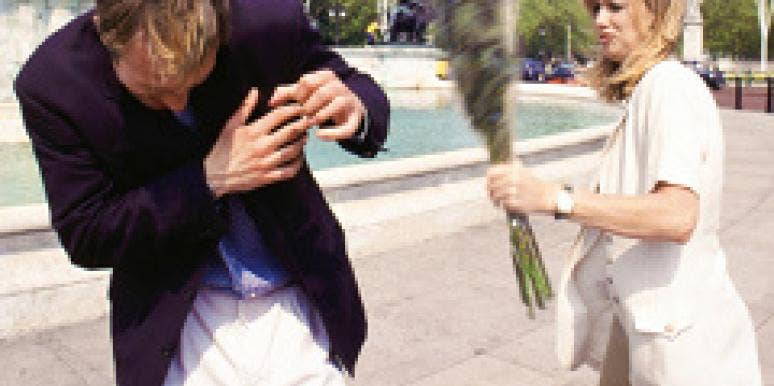 A woman confronts a man with flowers