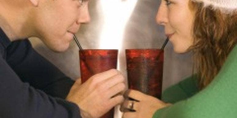Couple drinking soda