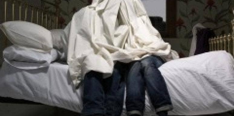 10 Signs Your Spouse Is Really A Stranger Couple hiding under sheets