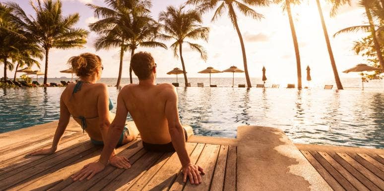 15 Best West Coast Beaches In The US couple laying on beach