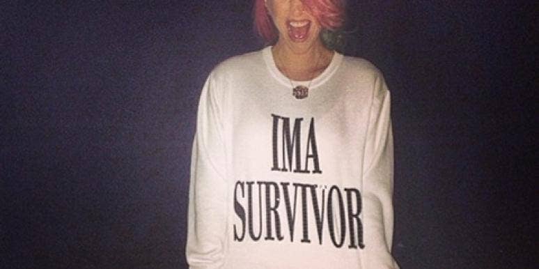 Kesha on the beach wearing an "I'm A Survivor" shirt post-rehab Kesha on the beach wearing an "I'm A Survivor" shirt post-rehab
