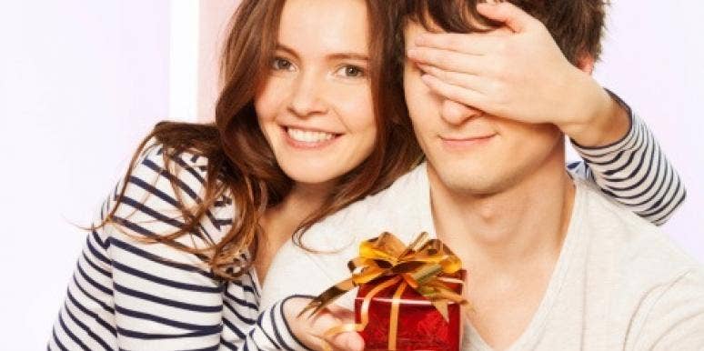 couple exchanging Christmas gifts couple exchanging Christmas gifts
