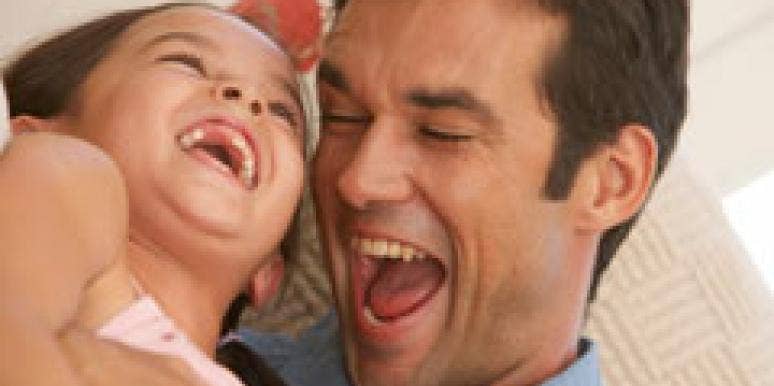 father and daughter laughing