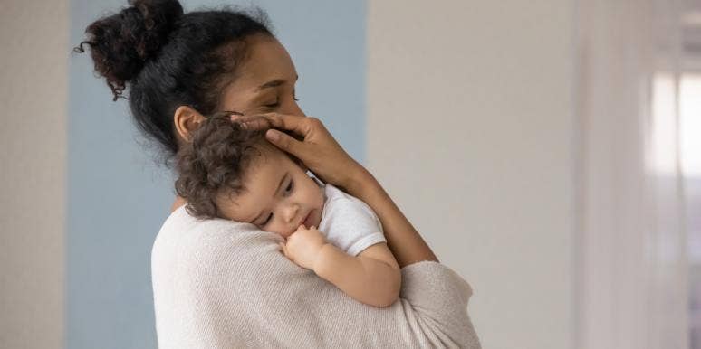 10 Parenting Mistakes You're Probably Making (And How To Fix Them) mom holding baby