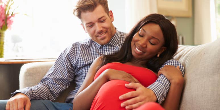 10 Huge Misconceptions About Starting A Family — Debunked! pregnant couple