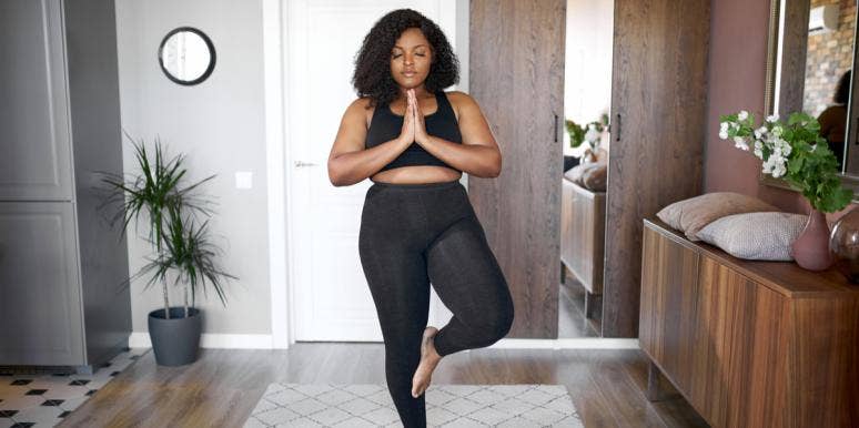 10 Signs You're Healthy, No Matter What The Scale Says woman doing yoga