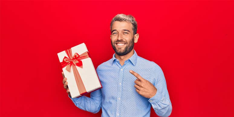 11 Subtle-But-Deadly Signs You're Being Love-Bombed man with a gift
