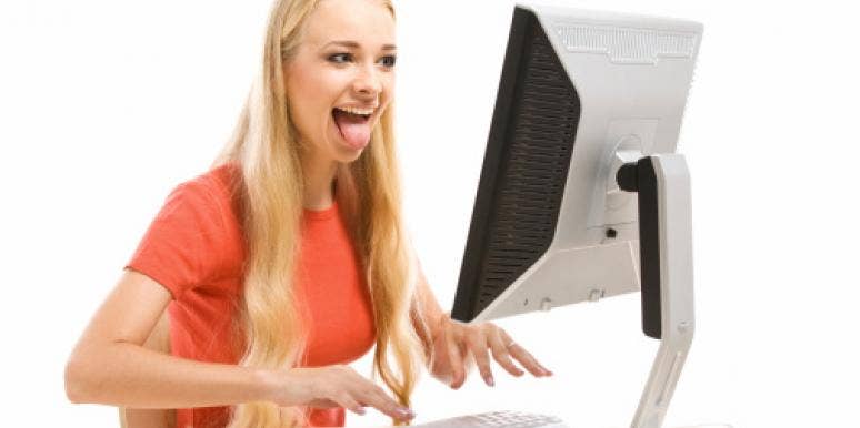 woman using computer Relationship Fail: Mushy, Gushy Couple Nausea On Facebook